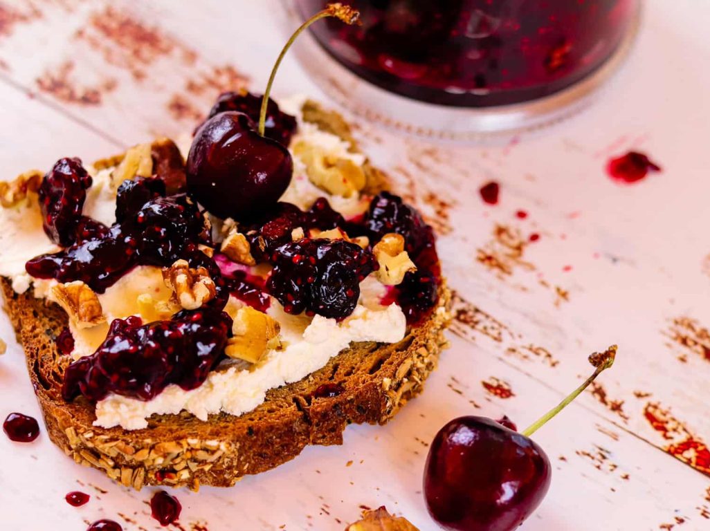 Cream Cheese And Cherry Jam On Toast