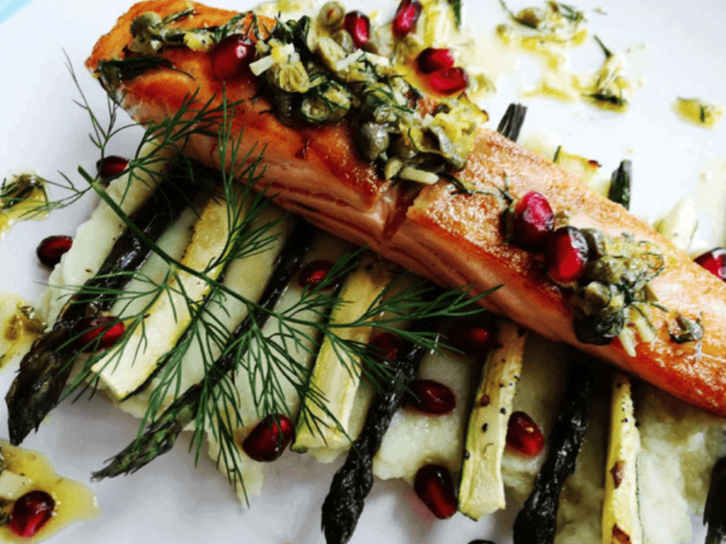 Salmon served on greens and cauliflower puree